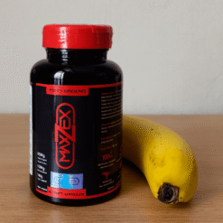 Lọ Maxzex chính hãng Nga đặt cạnh quả chuối chín trên bàn gỗ - Nhà thuốc Trung Thắng