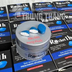 Viên uống Rocket 1H chính hãng Mỹ bẻ đôi lộ màu trắng bên trong đặt trên nắp hủ - Nhà thuốc Trung Thắng