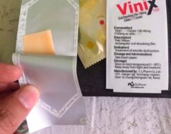 Tem ngậm Vinix chính hãng Hàn Quốc gói tem mở lấy miếng film vàng nhạt - Nhà thuốc Trung Thắng